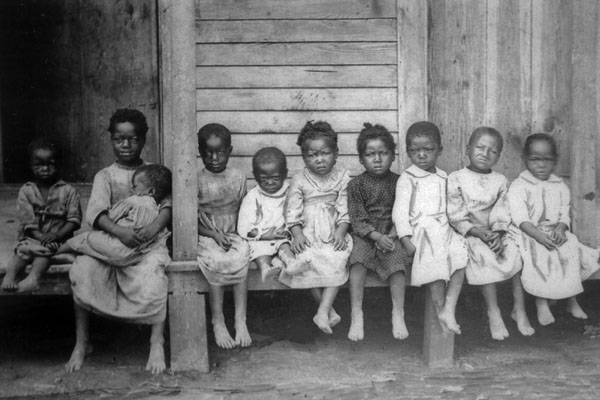 American Slavery: children on porch of cabin